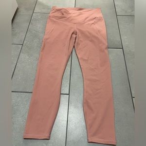 Medium. Fabletics rose colored leggings